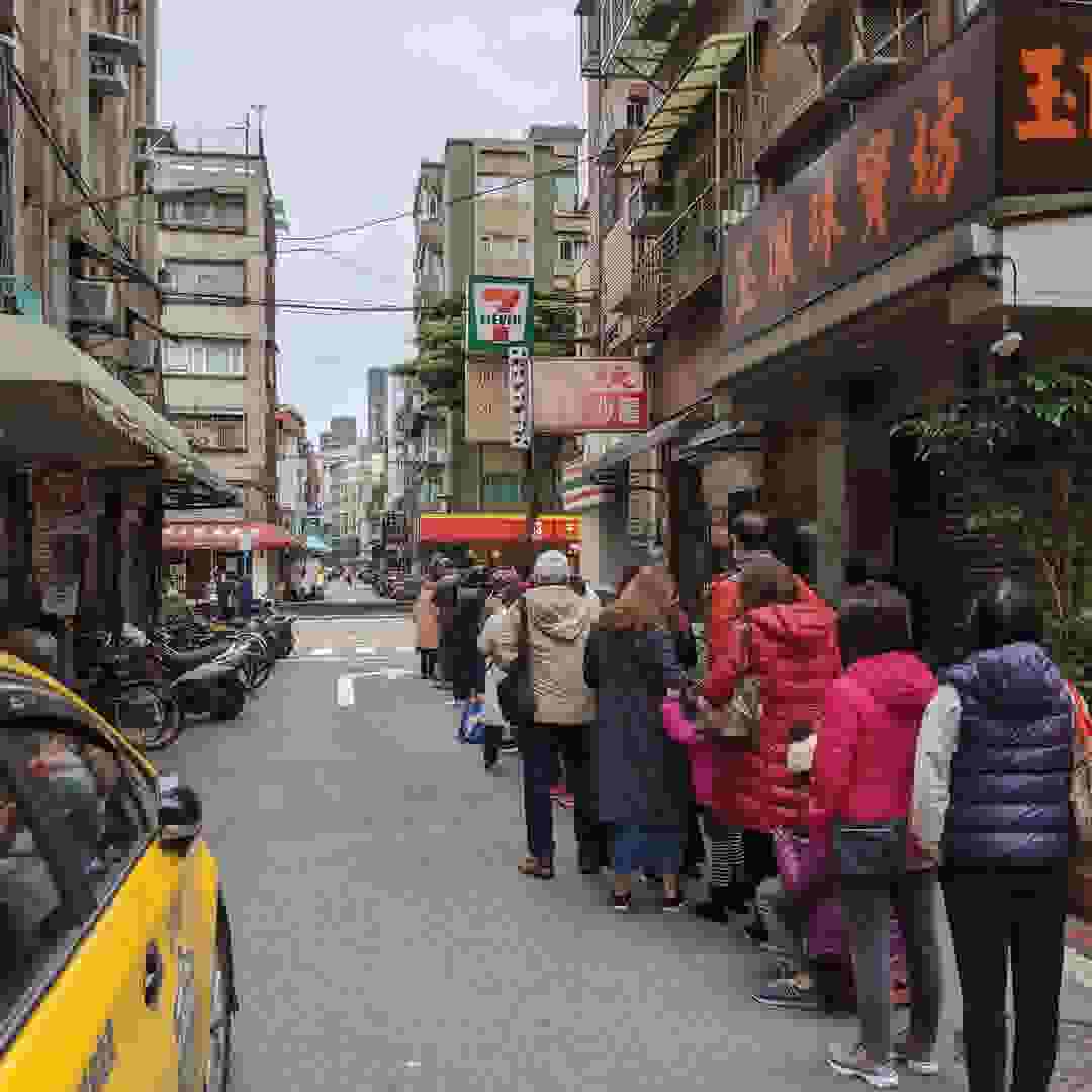 Line outside a pharmacy in Taiwan. People waiting to buy surgical masks.