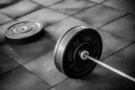 Weights in on the floor in a gym.