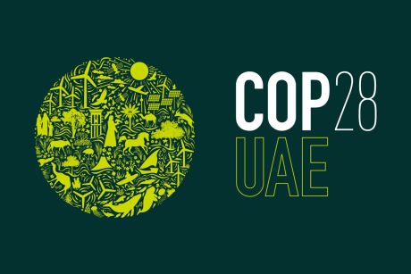 Logo of COP28 with a circle on the left featuring illustrations of green energy systems, animals and a man. On the right the text COP28 UAE.